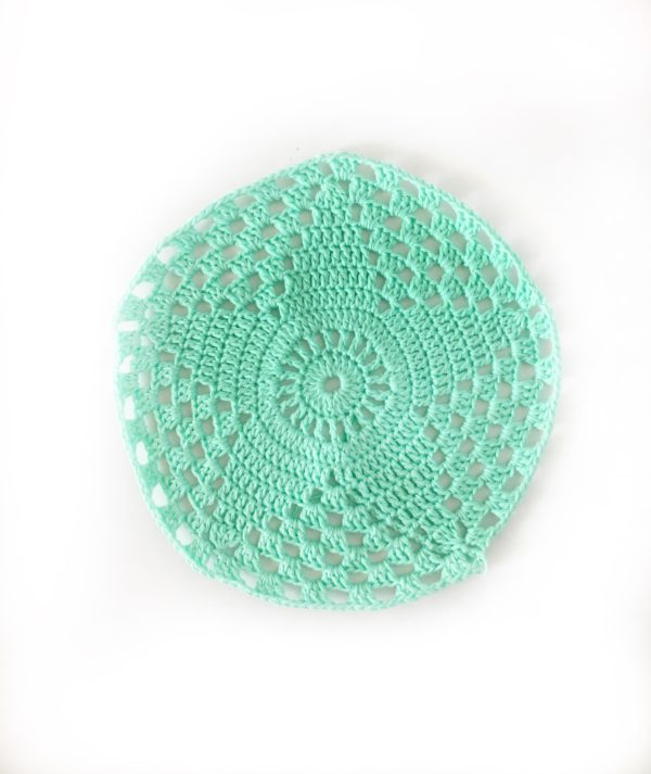 mint crochet star in circle on white background