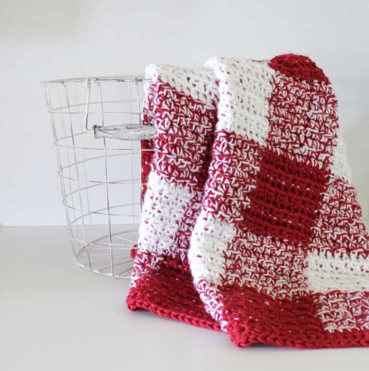 Crochet Red and white Gingham Blanket draped over wire basket