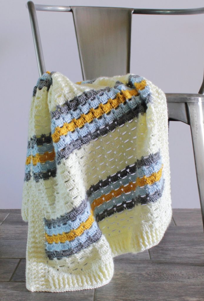 cream gold and blue crochet blanket