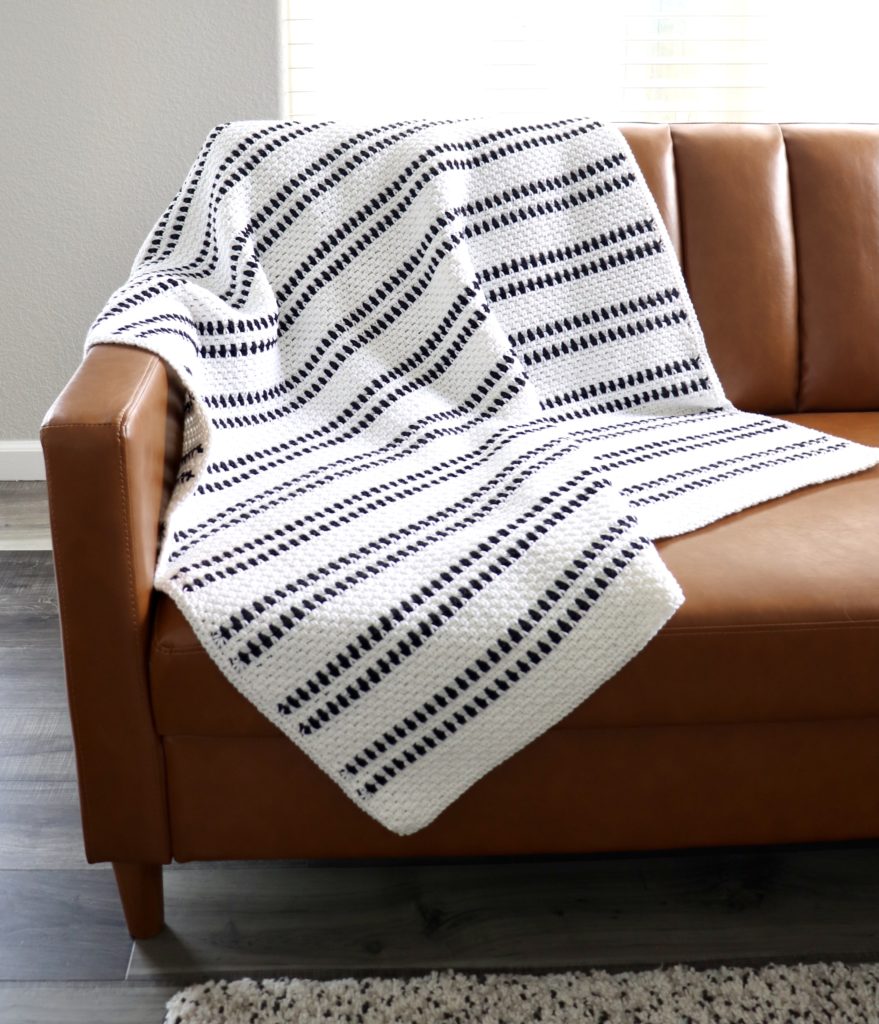 crochet moss stitch blanket on couch