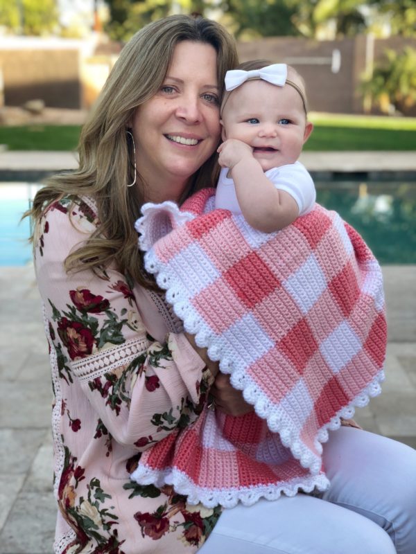 grandma and baby with pink gingham blanket
