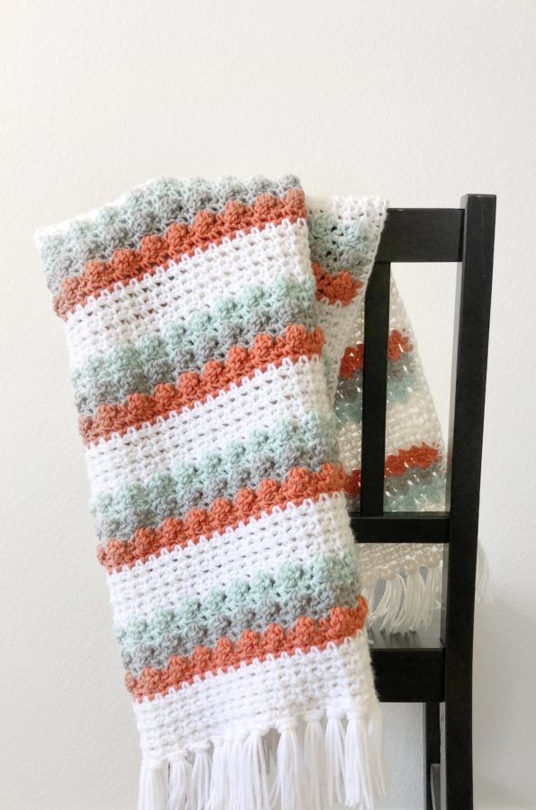 mesh and bobble blanket on chair
