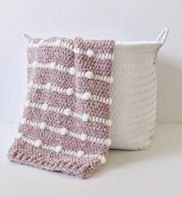 Crochet Velvet Dotted Lines Blanket in basket