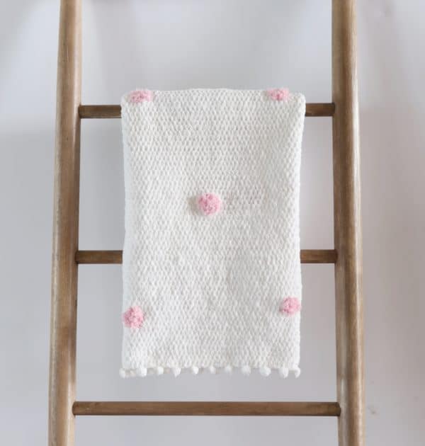 Crochet Pink Dots Baby Blanket on ladder