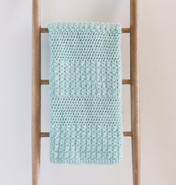 Bernat Textured Crochet Baby Blanket on ladder