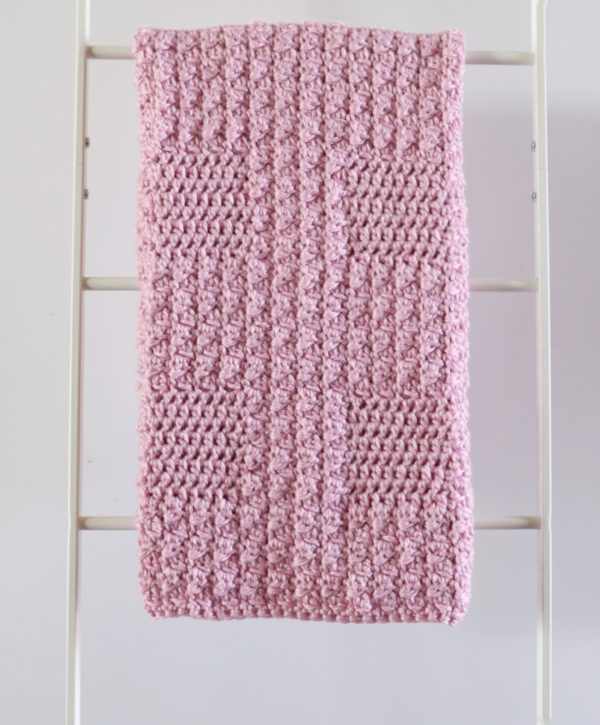 Crochet Textured Baby Blanket in Pink on ladder