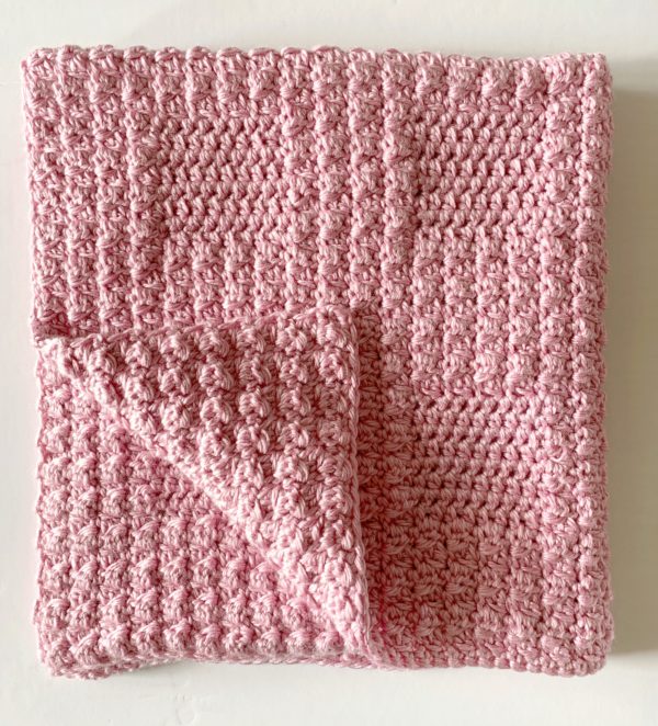 Crochet Textured Baby Blanket in Pink folded