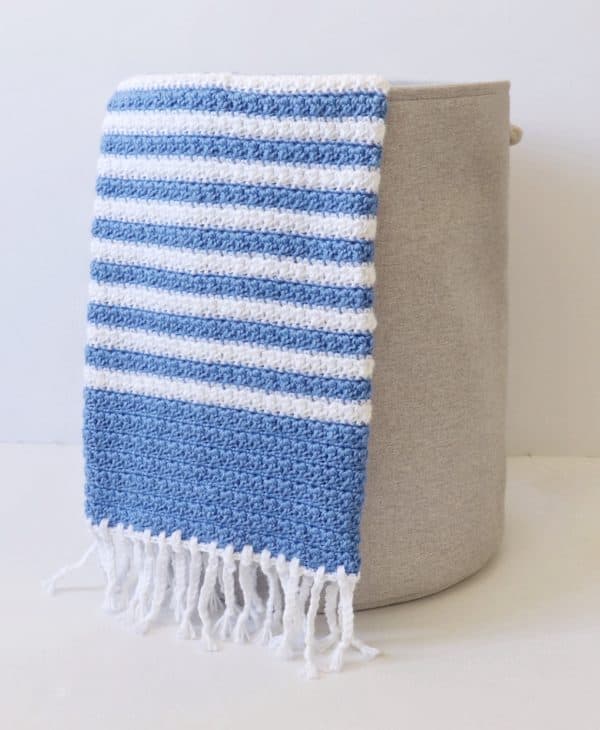 Crochet Blue Stripes Baby Blanket in basket