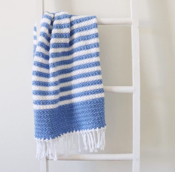 Crochet Blue Stripes Baby Blanket on ladder