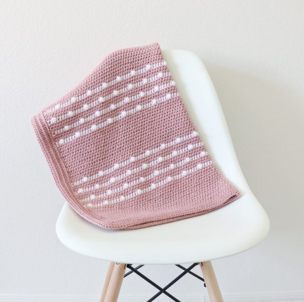 Crochet Polka Dot Lines Baby Blanket on chair