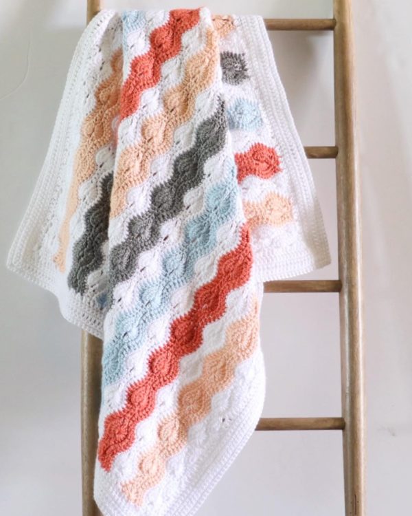 Modified Catherine's Wheel Stitch Baby Blanket on ladder