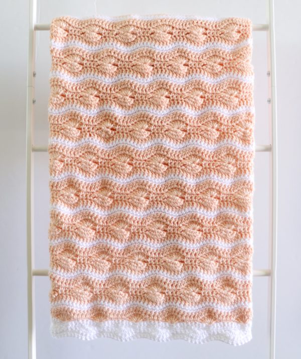 Crochet Catherine's Wheel Waves Blanket on ladder