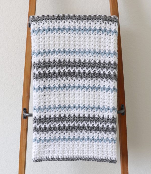 Crochet Blue and Gray V-Stitch Blanket on ladder