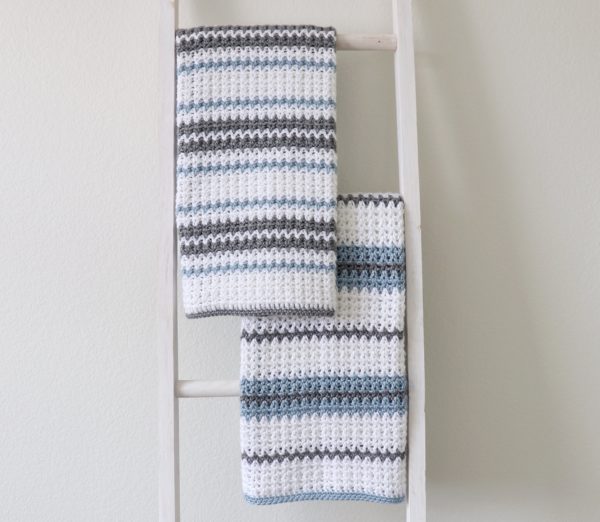 Crochet Blue and Gray V-Stitch Blankets on ladder