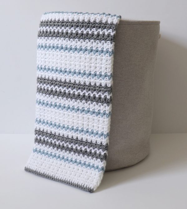 Crochet Blue and Gray V-Stitch Blanket in basket