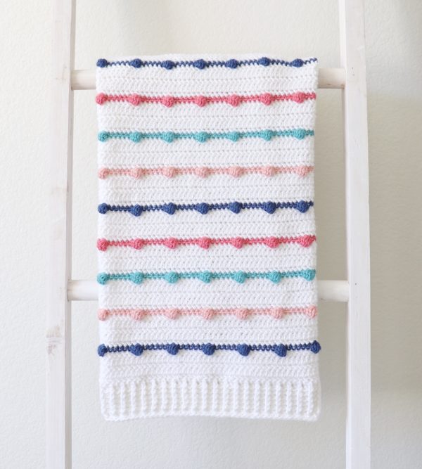 Crochet Bobble Lines Baby Blanket on ladder