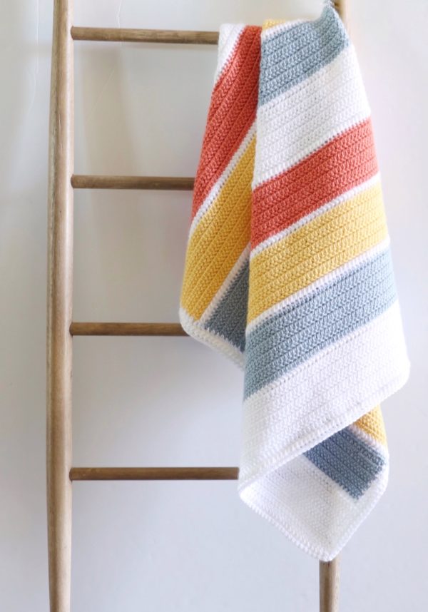 summertime stripes blanket on ladder