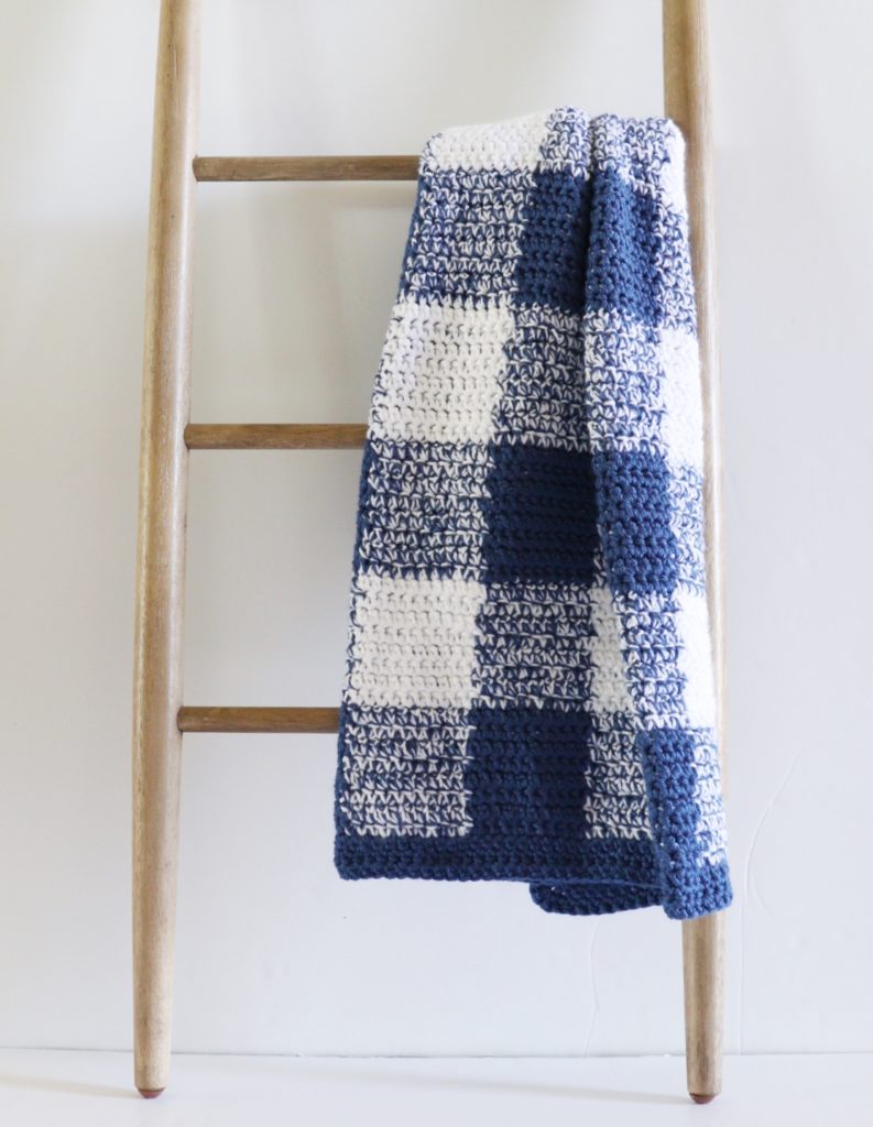 Navy Gingham Crochet Blanket on ladder