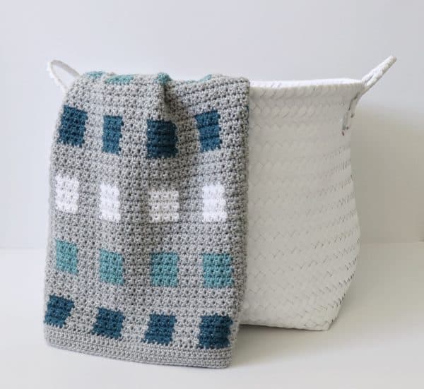 Crochet Even Squares Baby Blanket on basket