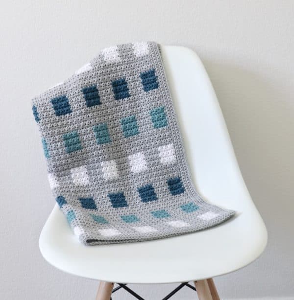 Crochet Even Squares Baby Blanket on chair