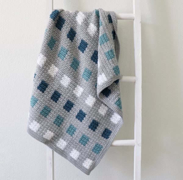 Crochet Even Squares Baby Blanket on ladder