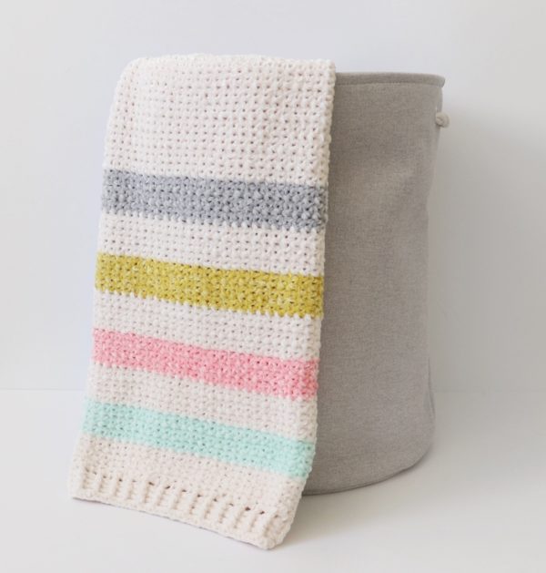 Crochet Unicorn Stripes Baby Blanket in basket