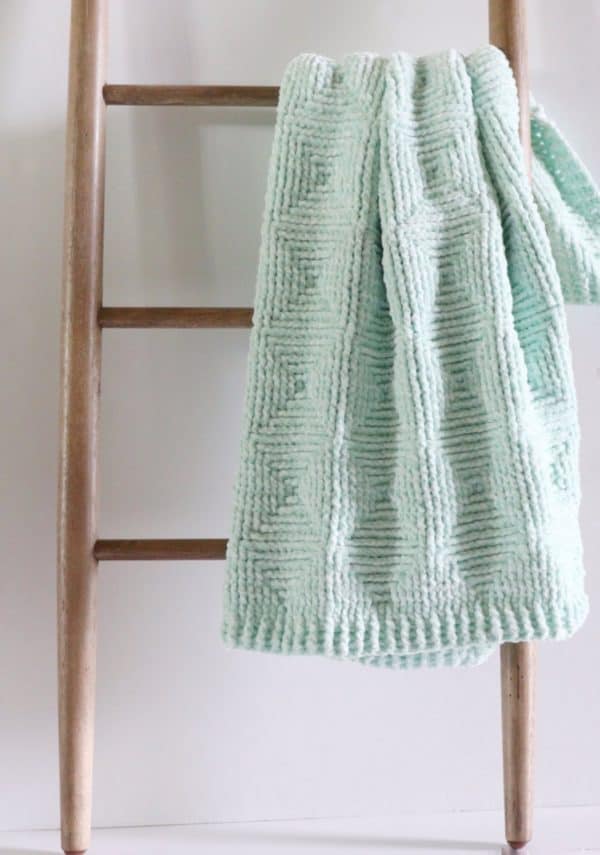 Crochet Ribbed Diamond Blanket on ladder