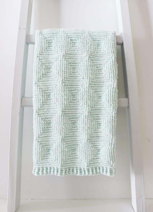 Crochet Ribbed Diamond Blanket on ladder