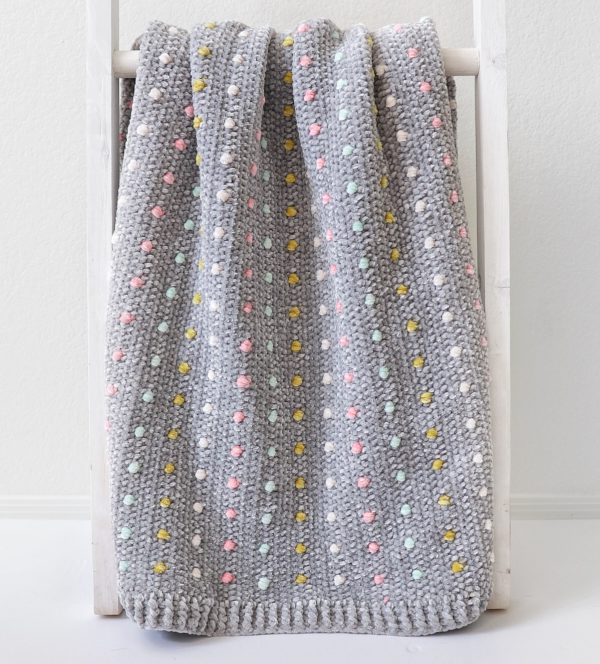Crochet Candy Dots Baby Blanket on ladder
