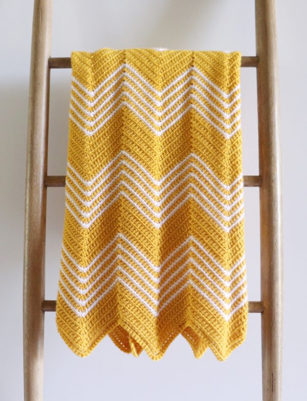 Crochet Gold Front Loop Chevron Blanket on ladder