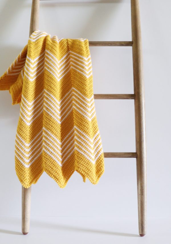 Crochet Gold Front Loop Chevron Blanket on ladder