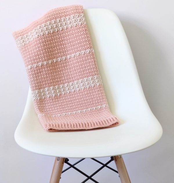mesh and berry blanket on chair
