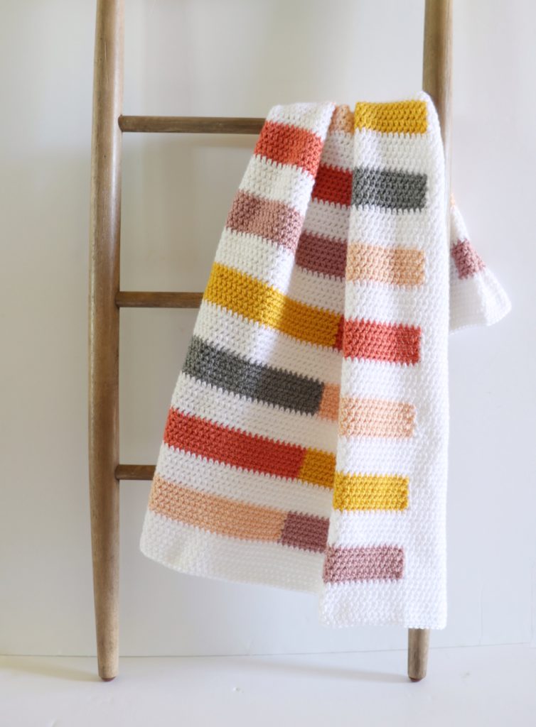 Colorful Half Stripe Blanket on ladder