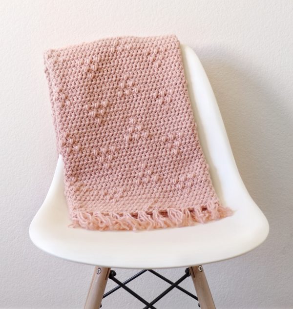 Crochet Triangle Puffs Blanket on chair