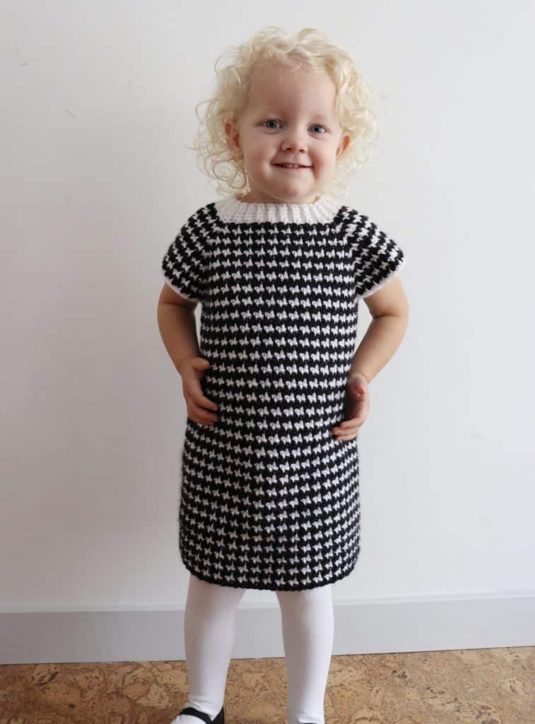 little girl wearing Crochet Houndstooth Baby Sweater Dress