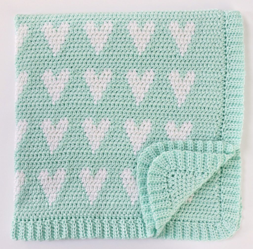 mint and white hearts blanket folded