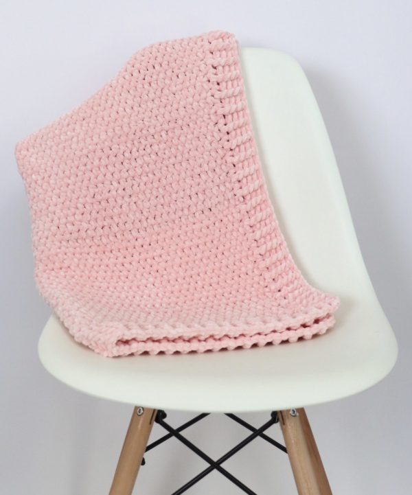 pink velvet blanket on chair