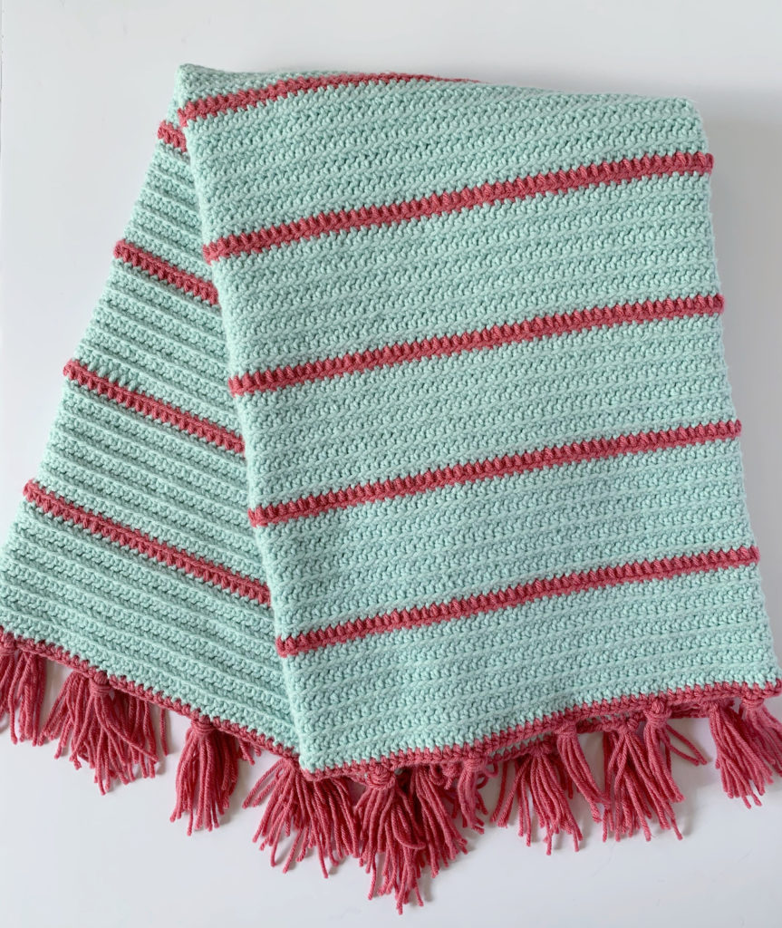 mint blanket with pink stripes