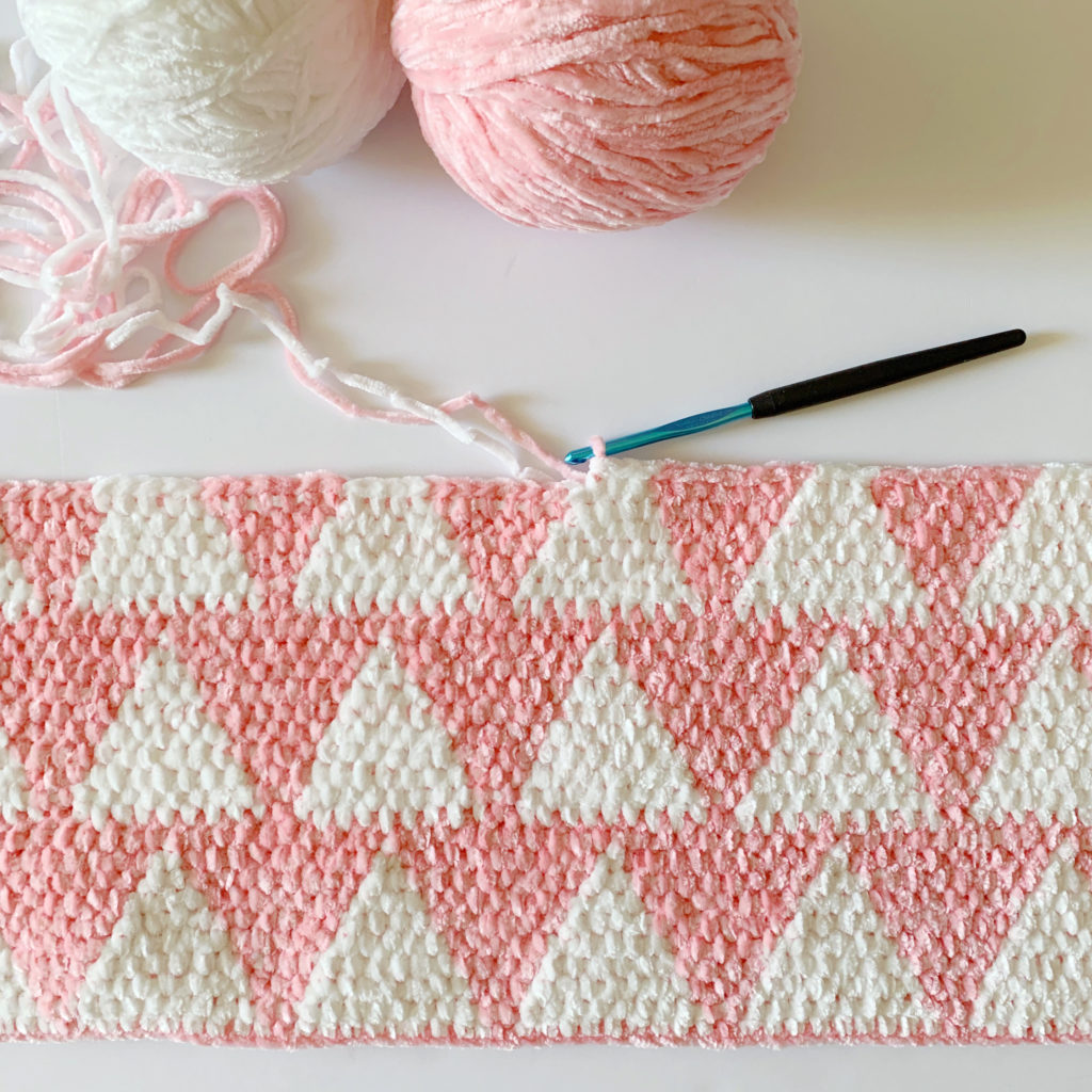 pink and white triangles crochet blanket in progress