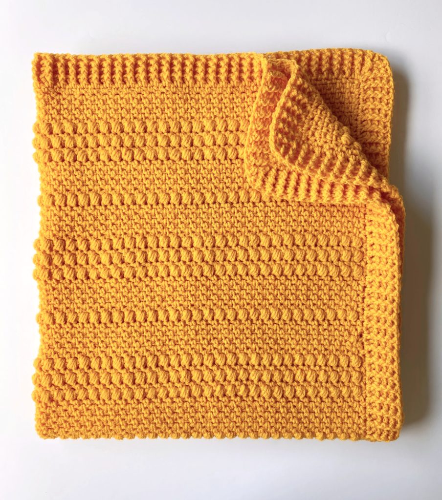 gold puffs blanket folded