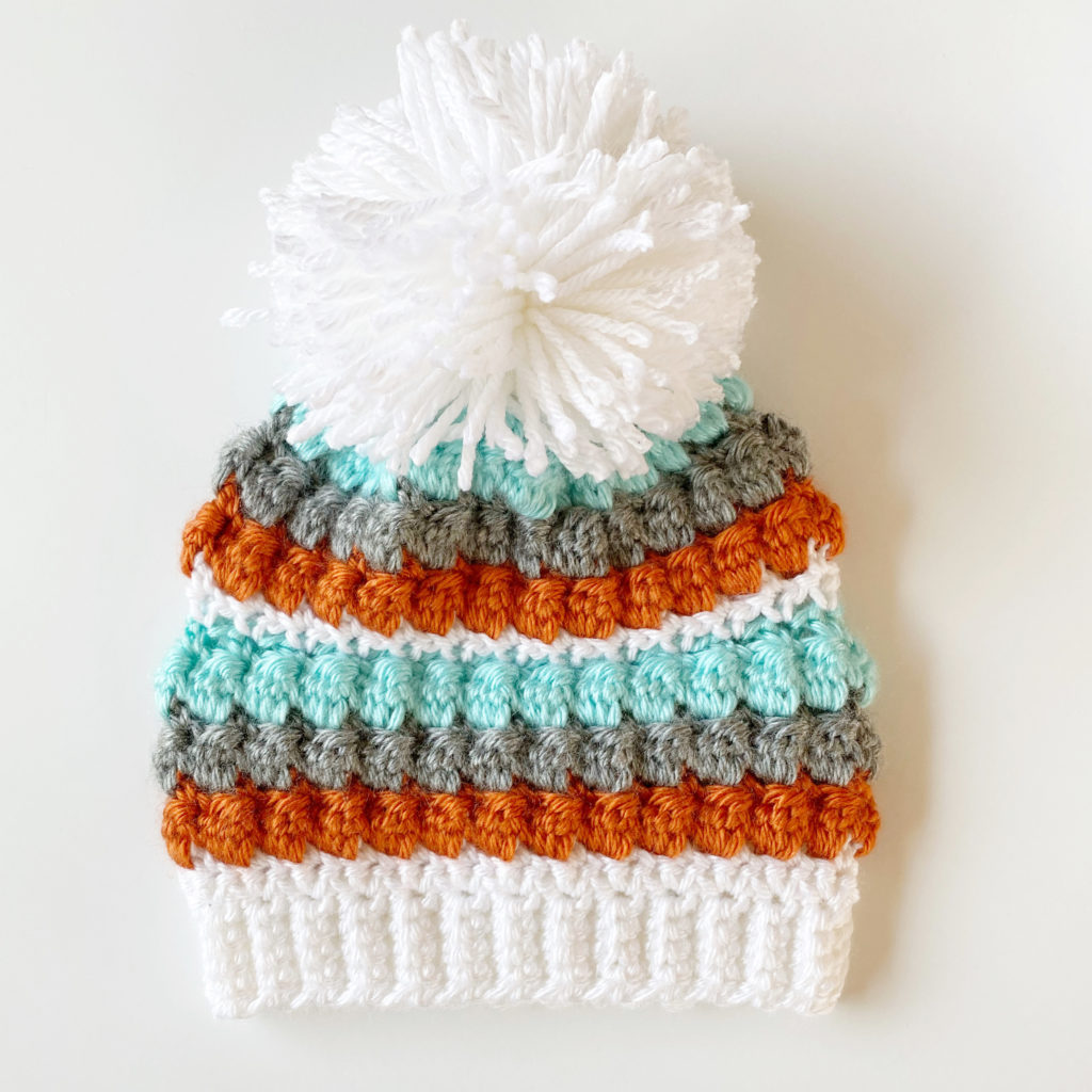 crochet mesh and bobble stitch hat with pom pom