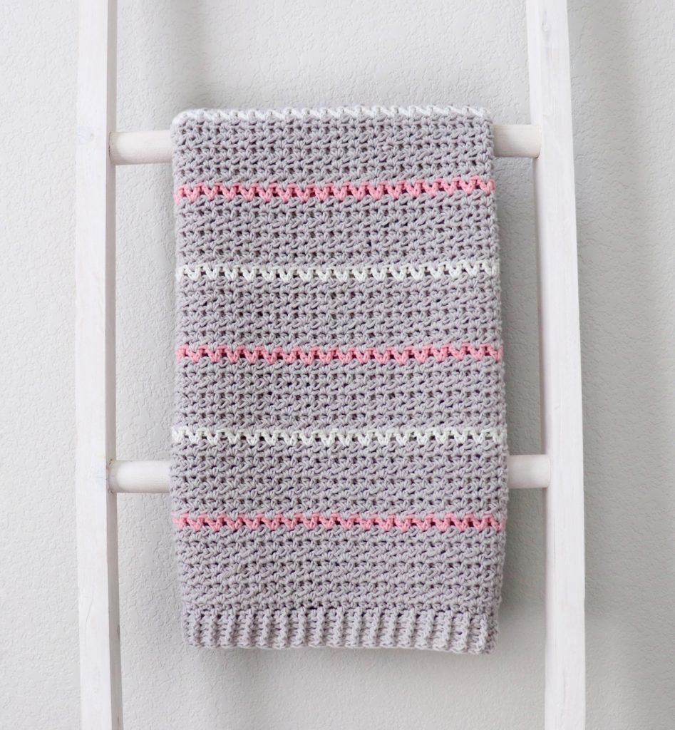 mixed v stitch crochet blanket on ladder