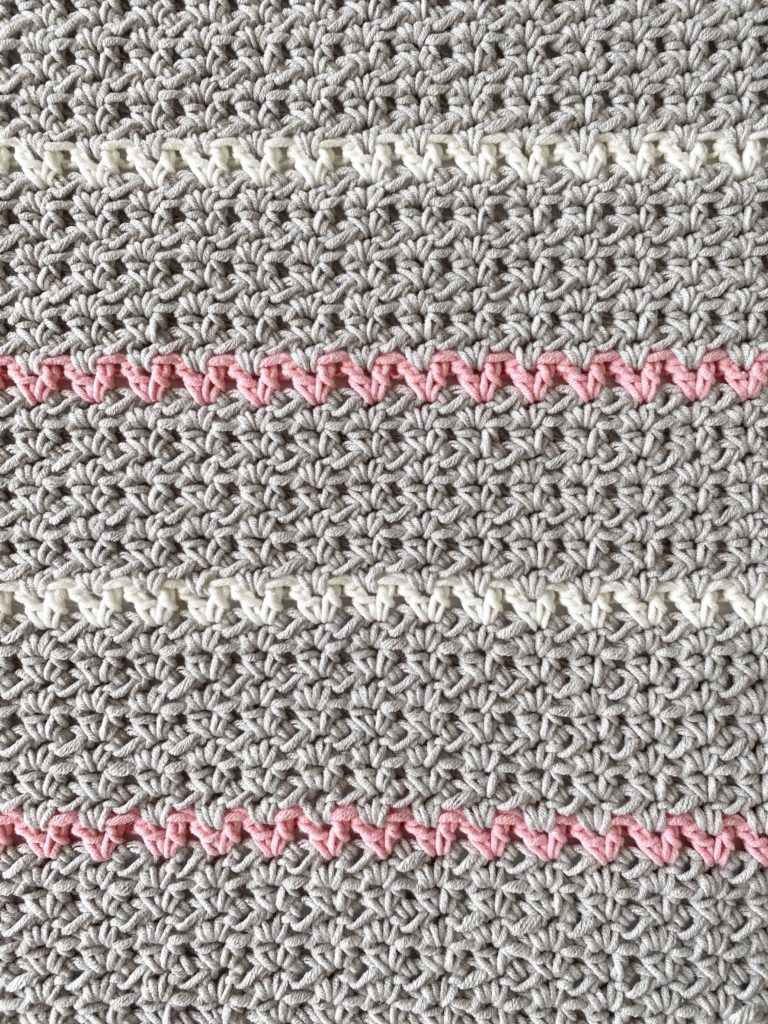 gray white pink v stitch blanket