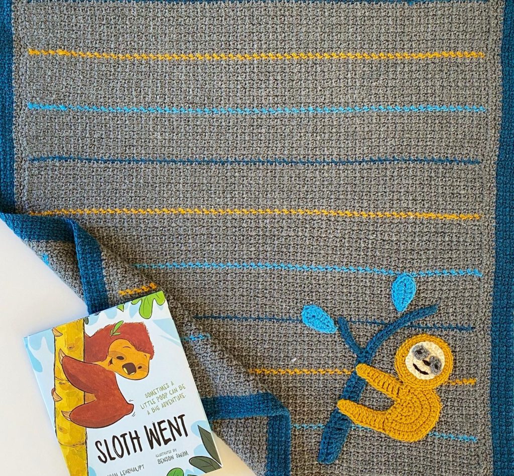 crochet sloth blanket with book