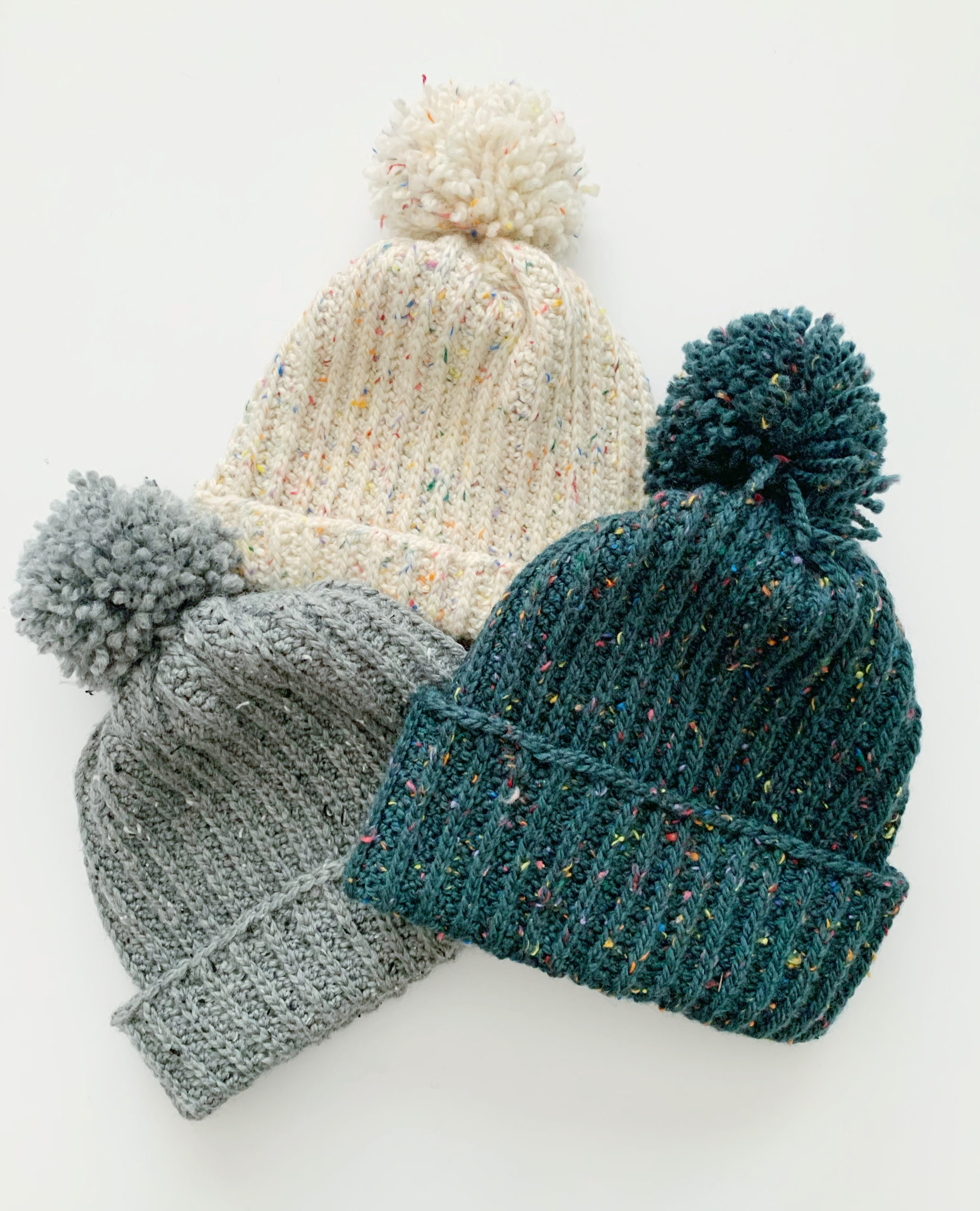 crochet hat with 2 pom poms