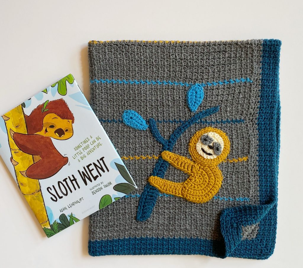 sloth crochet blanket with picture book