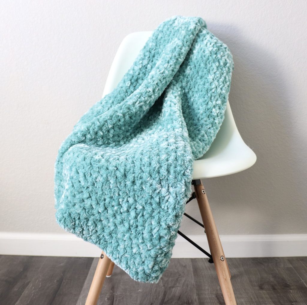 chunky velvet crochet throw on chair