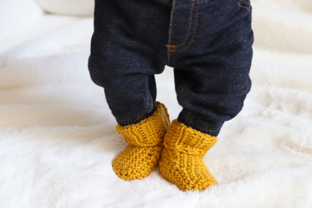 baby wearing crochet socks