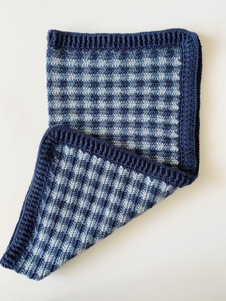 blue mini checked gingham crochet blanket folded