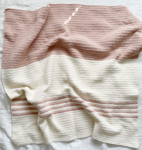pink and white crochet blanket
